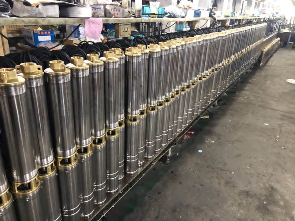 Rows of Apex submersible dewatering pumps assembled and ready for dispatch in the workshop
